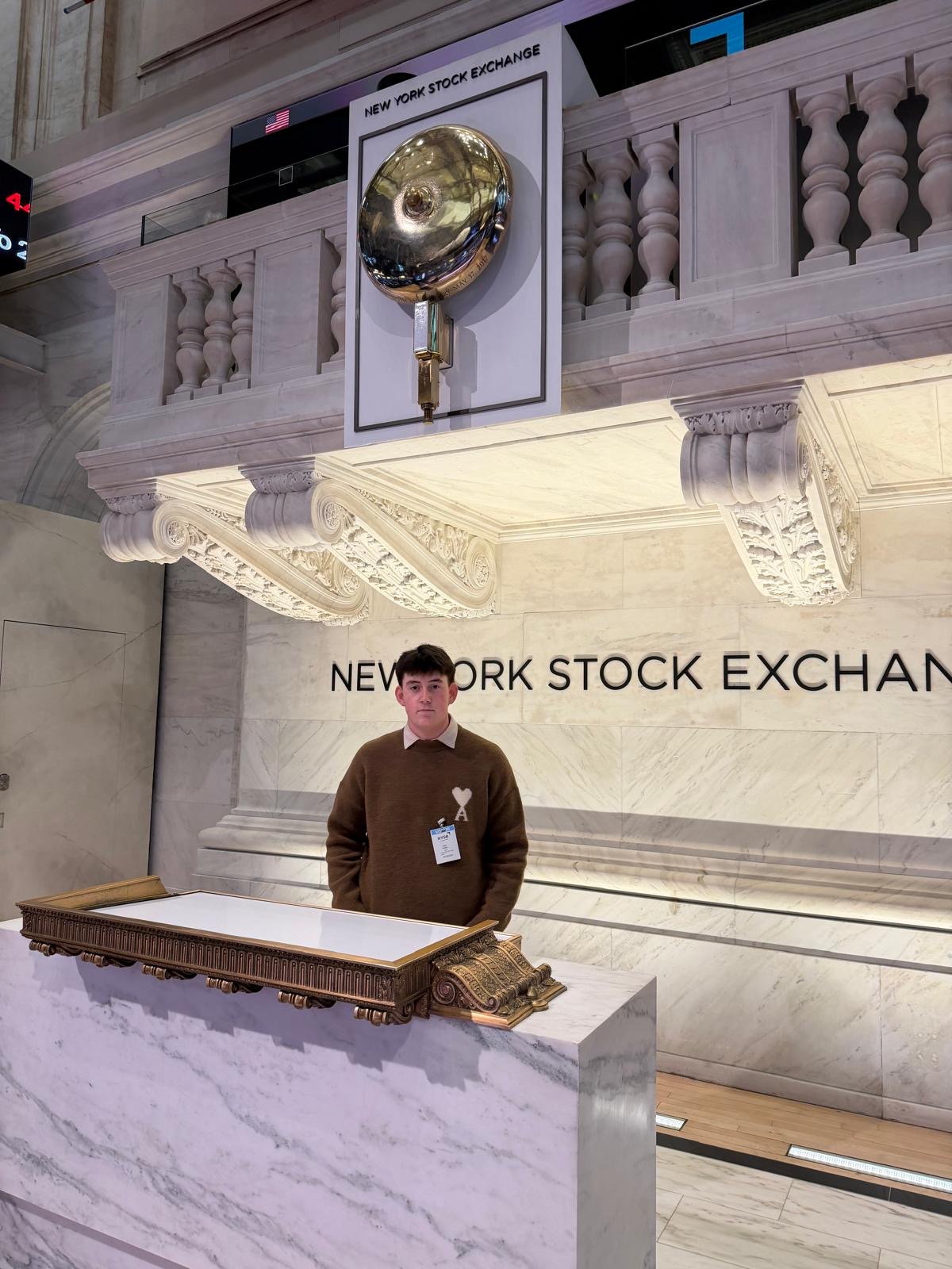 Standing beneath the NYSE bell